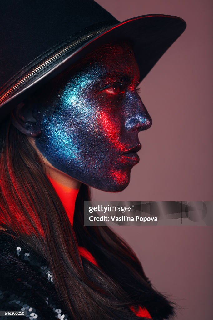 Woman with glitter on her face