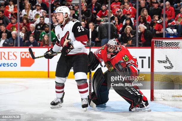 Ryan White of the Arizona Coyotes waits in position in front of goalie Corey Crawford of the Chicago Blackhawks in the second period at the United...