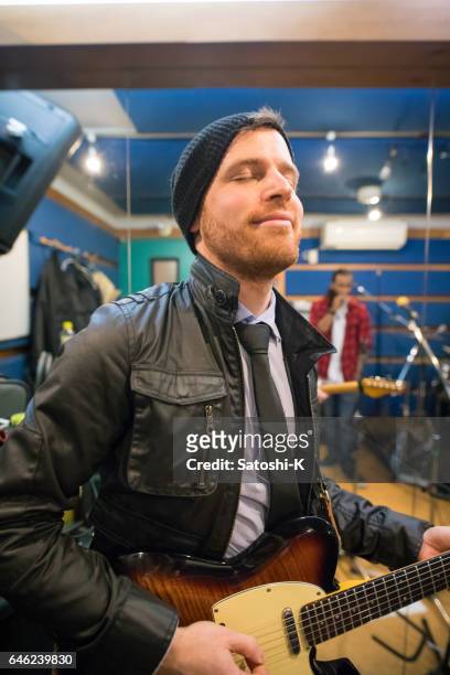 music band rehearsing in studio - music rehearsal stock pictures, royalty-free photos & images