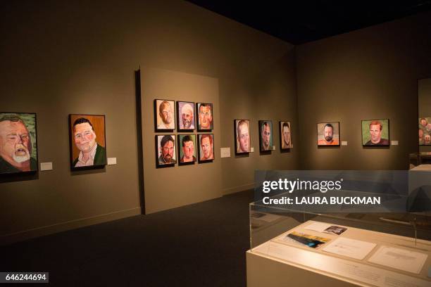 Paintings of wounded US military veterans painted by former US President George W. Bush hang in "Portraits of Courage", a new exhibit at the George...