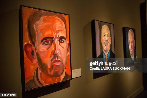 Paintings of wounded US military veterans painted by former US President George W. Bush hang in "Portraits of Courage", a new exhibit at the George...