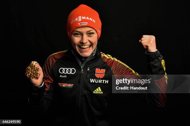 In this handout supplied by NordicFocus, Carina Vogt of Germany poses with the Gold medal after the medal ceremony for the Women's Ski Jumping HS100...