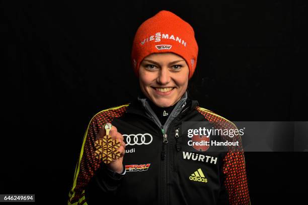 In this handout supplied by NordicFocus, Carina Vogt of Germany poses with the Gold medal after the medal ceremony for the Women's Ski Jumping HS100...