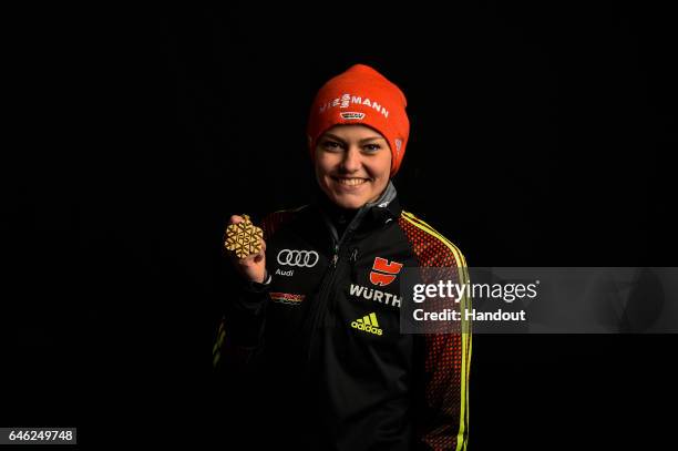 In this handout supplied by NordicFocus, Carina Vogt of Germany poses with the Gold medal after the medal ceremony for the Women's Ski Jumping HS100...