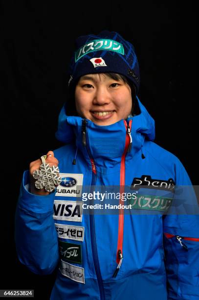 In this handout supplied by NordicFocus, Yuki Ito of Japan poses with the Silver medal after the medal ceremony for the Women's Ski Jumping HS100...