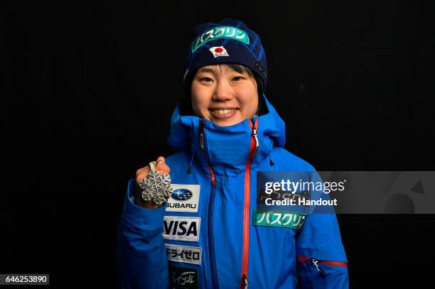 In this handout supplied by NordicFocus, Yuki Ito of Japan poses with the Silver medal after the medal ceremony for the Women's Ski Jumping HS100...