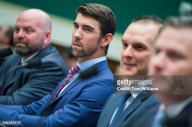 From left, Olympic gold medalists Adam Nelson and Michael Phelps, Travis Tygart, CEO of the U.S. Anti-Doping Agency, and Rob Koehler of the World...