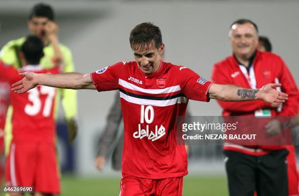 Persepolis's Farshad Ahmadzadeh celebrates after winning the AFC Champions League qualifying football match between UAE's Al-Wahda and Iran's...