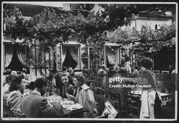 Customers at the wine garden in the former home of Beethovan in Vienna.
