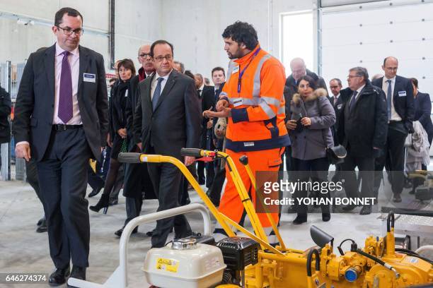 French President Francois Hollande visits the machines room as he attends the inauguration of the new "Sud Europe Atlantique" high-speed rail line,...