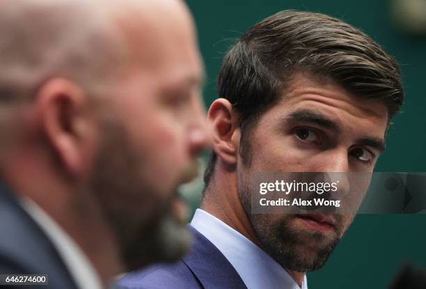 American swimmer and Olympic gold medalist Michael Phelps listens during a hearing before the Oversight and Investigations Subcommittee of House...