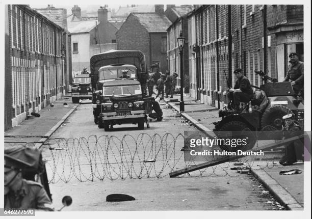 Soldiers on a street Belfast during the sectarian riots that erupted in Northern Ireland at the time of the Civil Rights Movement.