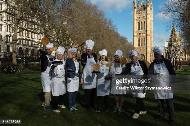 Clive Lewis, Steve Pound, Tracey Crouch, Rob Flello, Victoria Atkins, Seema Kennedy, Tim Loughton and Johnny Mercer practice flipping their pancakes...