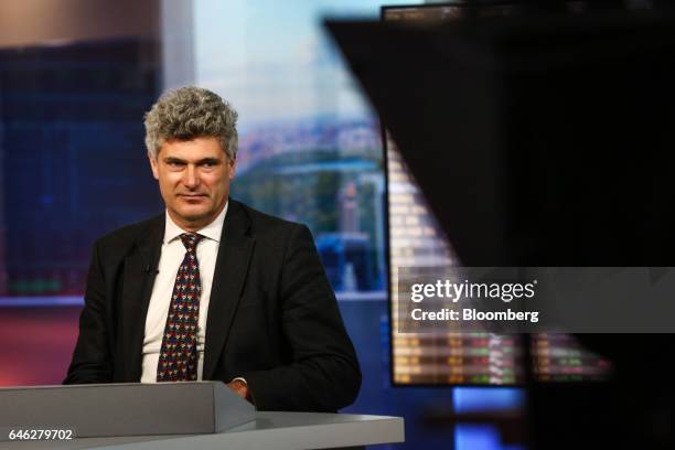 Dominic Konstam, managing director of Deutsche Bank Securities Inc., listens during a Bloomberg Television interview in New York, U.S., on Tuesday,...