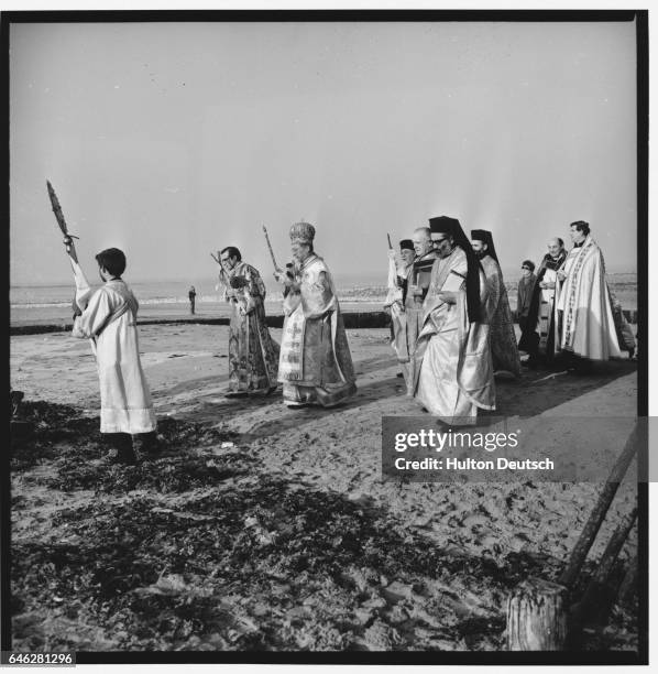 Dignitaries of the Roman Catholic Church and the Church of England accompany His Eminence Athenagoras the Lord Archbishop of Thyateira and Great...