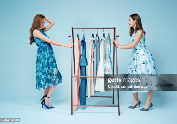 sisters show clothes - blue dress imagens e fotografias de stock