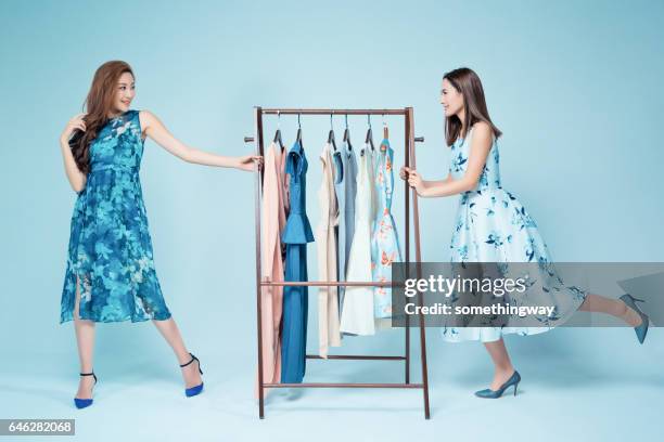 sisters show clothes - blue dress hanger stock pictures, royalty-free photos & images