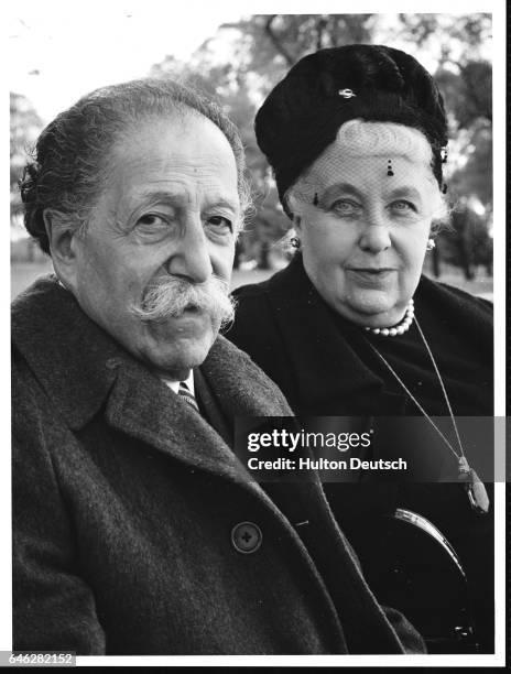 French conductor and violinist Pierre Monteux with his wife Doris in Hyde Park, London, 1963.