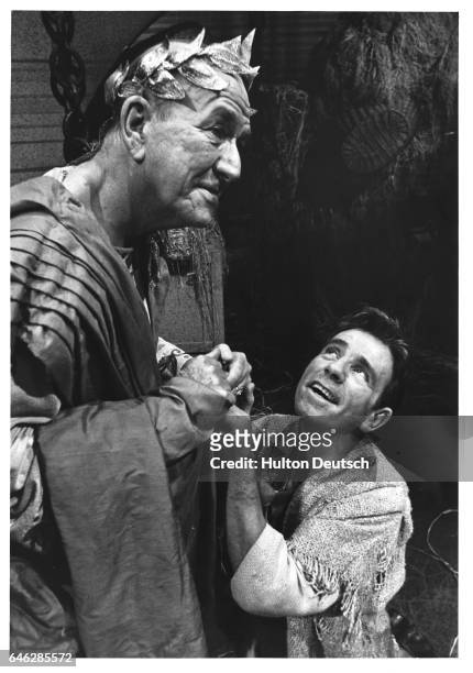 Comic actor Norman Wisdom with actor, writer and composer Noel Coward, during the filming of Androcles and the Lion, 1967.