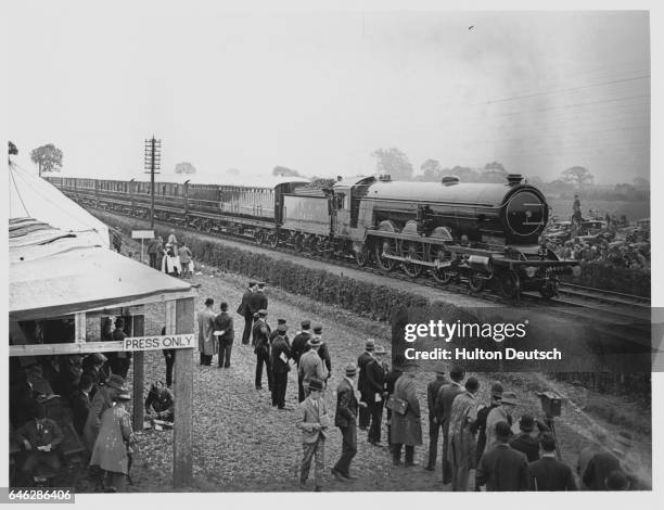 London and North Eastern Railway's vestibuled train passes a press stand set up for the centennial celebrations of the Stockton and Darlington...