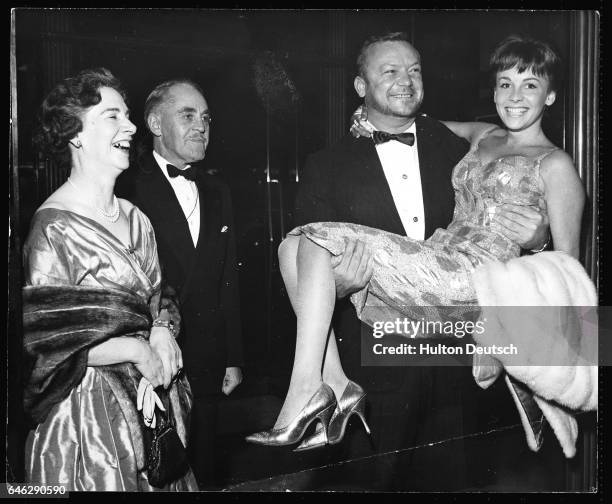 Actor Aldo Ray attends the premiere of his latest film The Day They Robbed the Bank of England with his wife Johanna and her parents Major General...