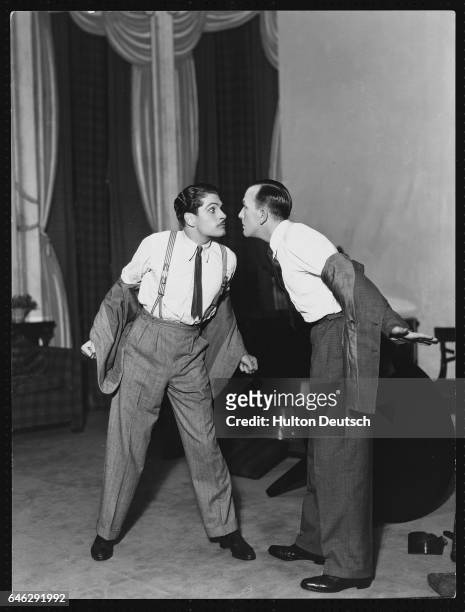 Laurence Olivier and Noel Coward in a scene from Coward's comedy Private Lives at the Phoenix Theatre, 1930.