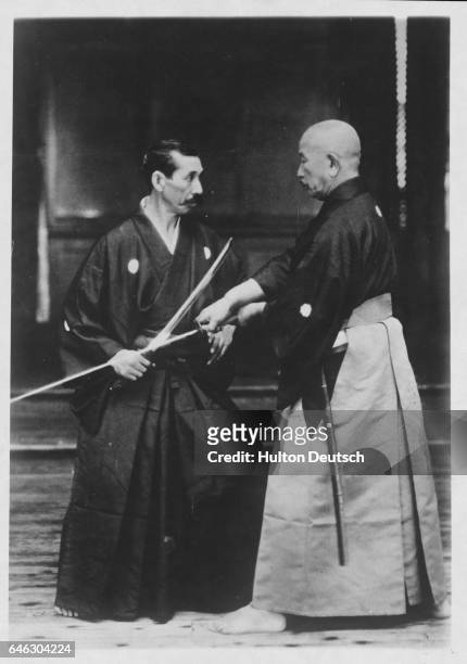 Two masters of Japanese fencing, Sasaburo Takano , and Hiromich Najayam, engaged in combat.
