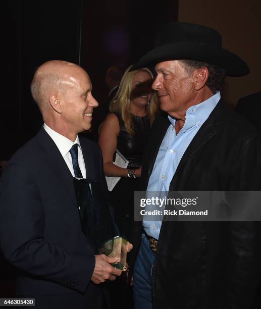 Scott Hamilton and George Strait attend the T.J. Martell Foundation 9th Annual Nashville Honors Gala at Omni Hotel on February 27, 2017 in Nashville,...