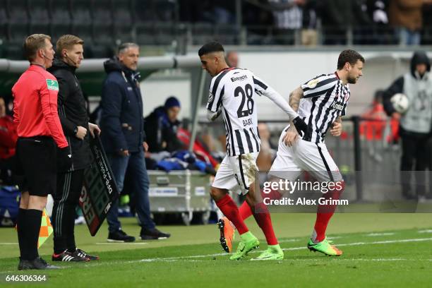 Marco Russ of Frankfurt replaces Aymane Barkok during the DFB Cup quarter final between Eintracht Frankfurt and Arminia Bielefeld at Commerzbank...