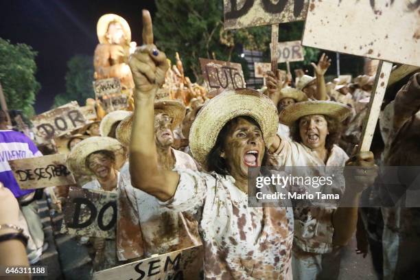 Revelers from the Portela samba school prepare to perform outside the Sambodrome in the early morning hours during Carnival festivities on February...