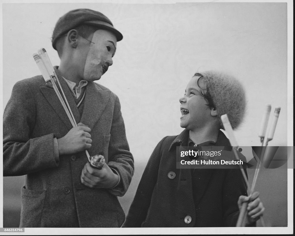 Sister Laughing at Brother's Mask