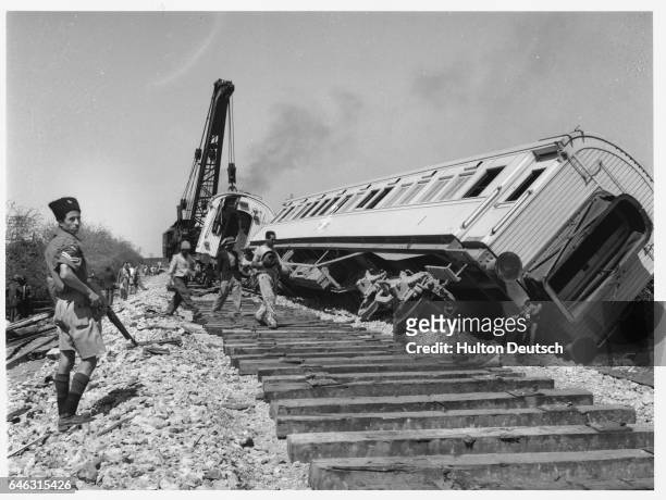 The remains of the Cairo to Haifa train which had been transporting troops before coming under attack by Jewish terrorists. 5 out of 11 British...