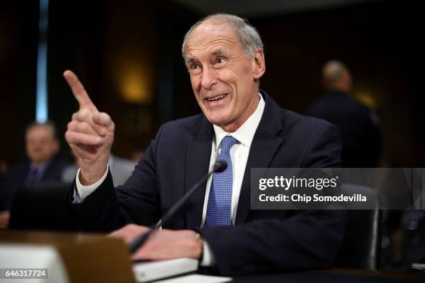 Former U.S. Senator Dan Coats prepares to testify during his confirmation hearing before the Senate Select Intelligence Committee to be the next...