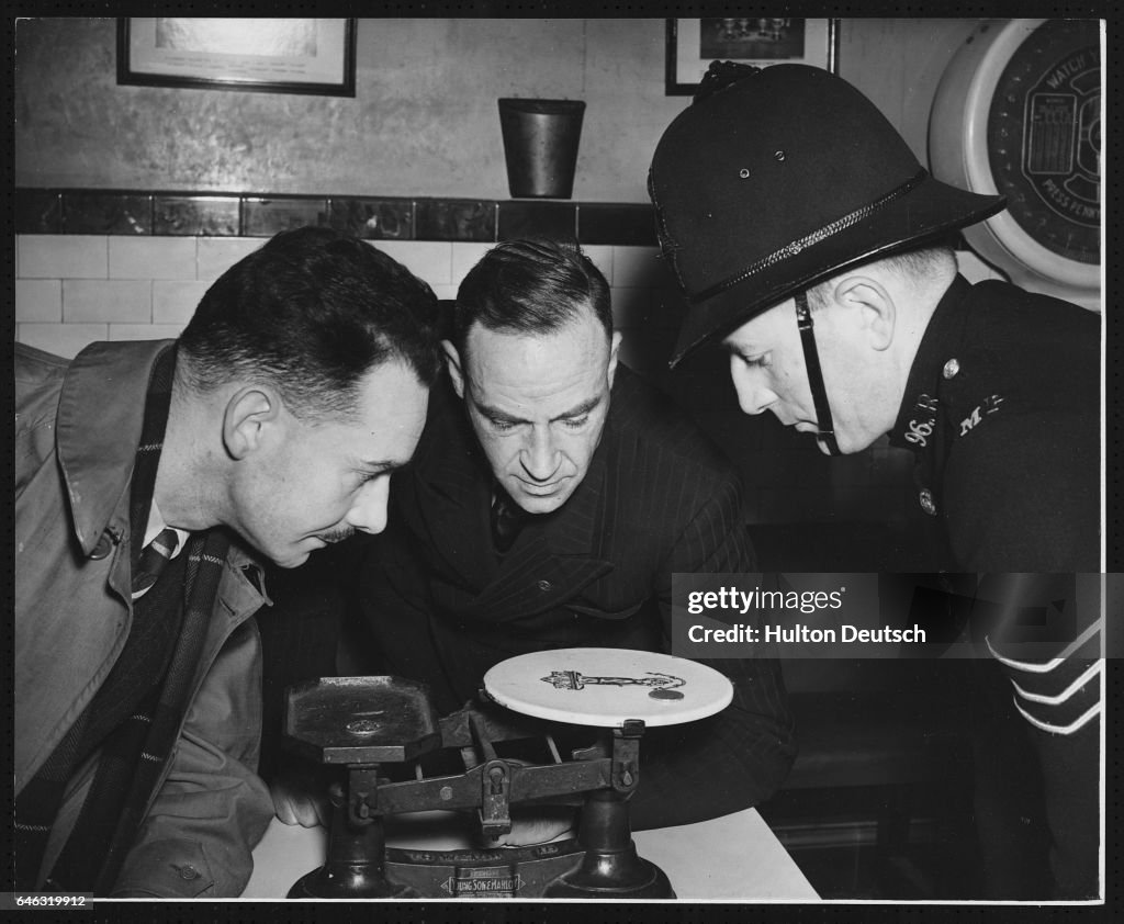 Sergents Demostrating Qualities of Counterfeit Coins