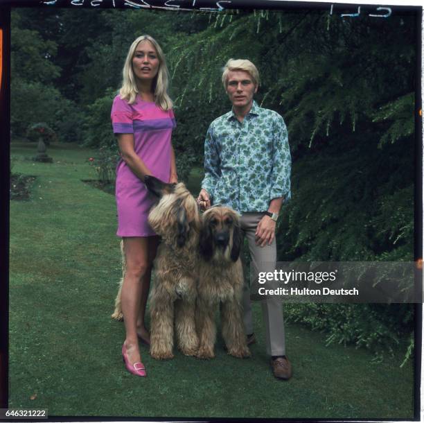 Singer and actor Adam Faith and his wife Jackie Irving in their garden.