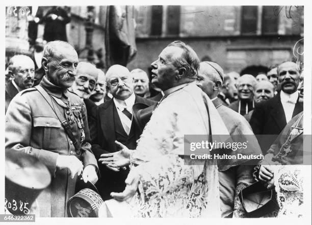 Clergyman Touchet engages marshal Ferdinand Foch in conversation during the Joan of Arc celebrations at Orleans.