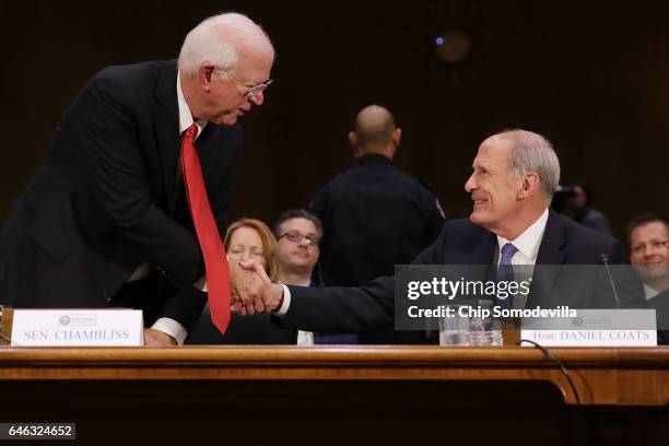 Former U.S. Senator Dan Coats thanks former Sen. Saxby Chambliss during Coats' confirmation hearing before the Senate Select Intelligence Committee...