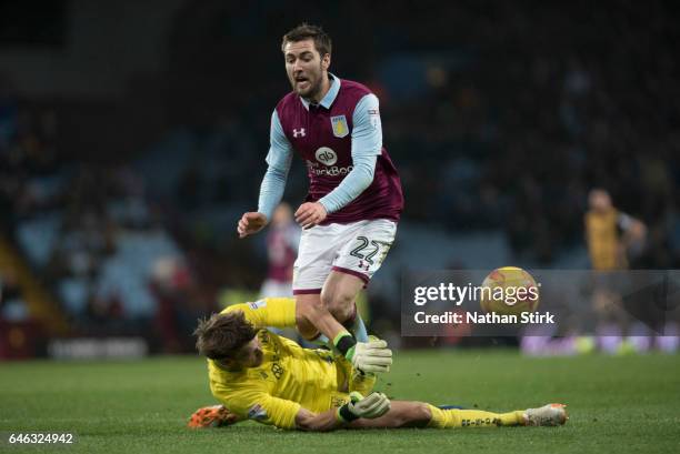 Gary Gardner of Aston Villa is awarded a penalty after Fabian Giefer of Bristol City miss times his tackle during the Sky Bet Championship match...