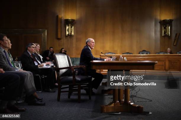 Former U.S. Senator Dan Coats testifies during his confirmation hearing before the Senate Select Intelligence Committee to be the next Director of...