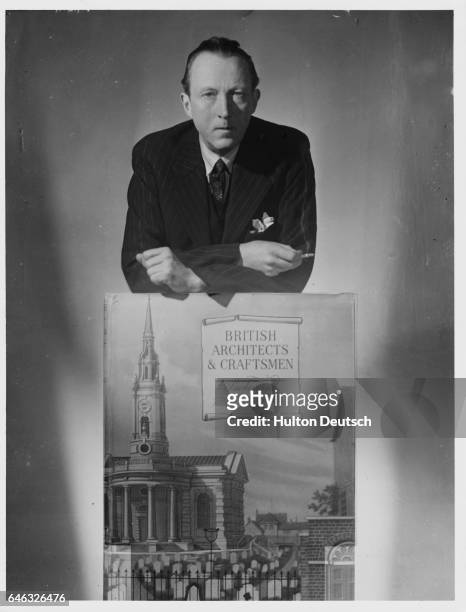 The English writer and art critic Sacheverell Sitwell with a poster, British Architects and Craftsmen. He was the younger brother of the poet Edith...