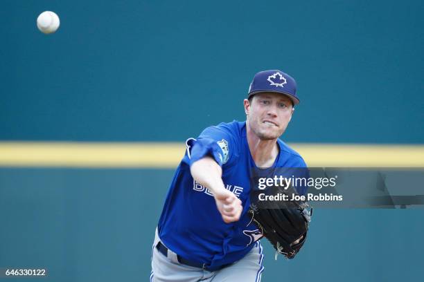 Lucas Harrell of the Toronto Blue Jays warms up before the first inning of a Grapefruit League spring training game against the Pittsburgh Pirates at...