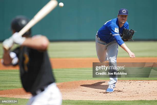 Lucas Harrell of the Toronto Blue Jays pitches in the first inning of a Grapefruit League spring training game against the Pittsburgh Pirates at...