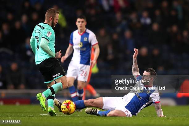 Danny Guthrie of Blackburn Rovers tackles Johnny Russell of Derby County during the Sky Bet Championship match between Blackburn Rovers and Derby...