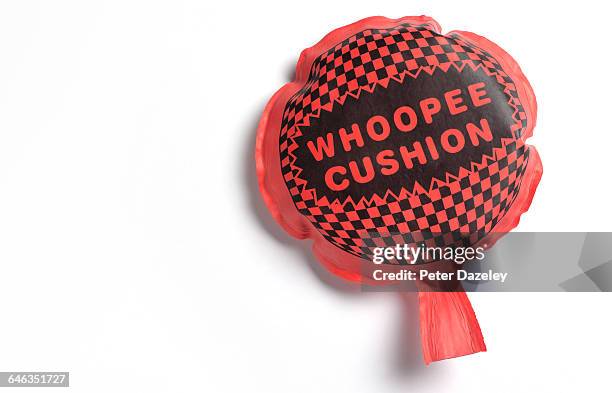 whoopee cushion with copy space - furzen stock-fotos und bilder