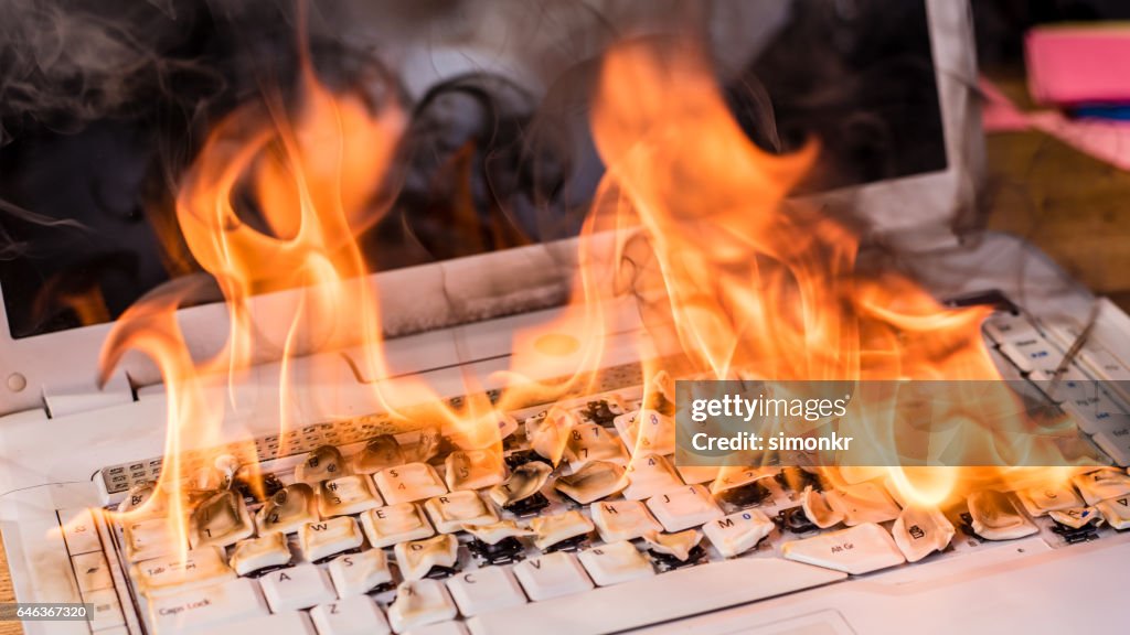 Laptop In Fire High-Res Stock Photo - Getty Images