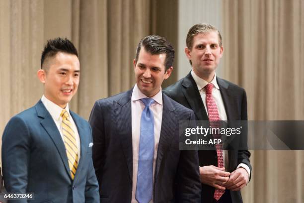 Joo Kim Tiah, CEO of the Holborn Group; Donald Trump Jr., and Eric Trump, attend the ribbon cutting ceremony inaugurating the Trump International...