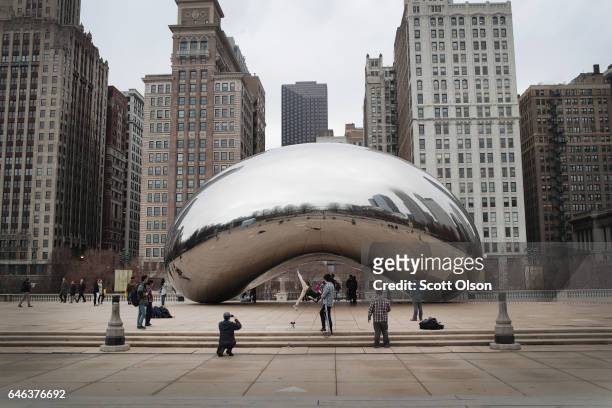 Visitors look over the Cloud Gate sculpture in Millennium Park on February 28, 2017 in Chicago, Illinois. For the first time since the city has been...
