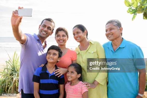 multi generation family taking selfie with phone - sri lankan ethnicity stock pictures, royalty-free photos & images