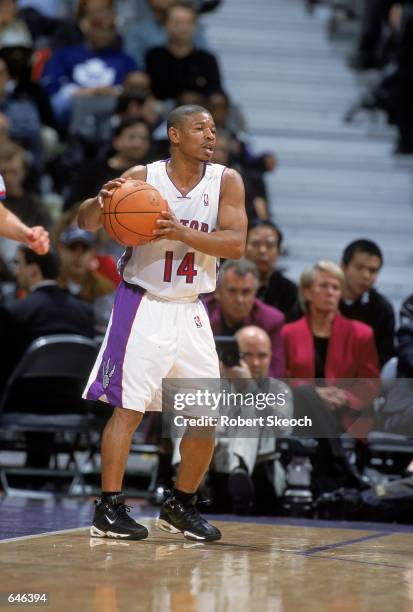 Muggsy Bogues of the Toronto Raptors moves with the ball during the game against the Detroit Pistons at the Air Canada Center in Toronto, Canada. The...