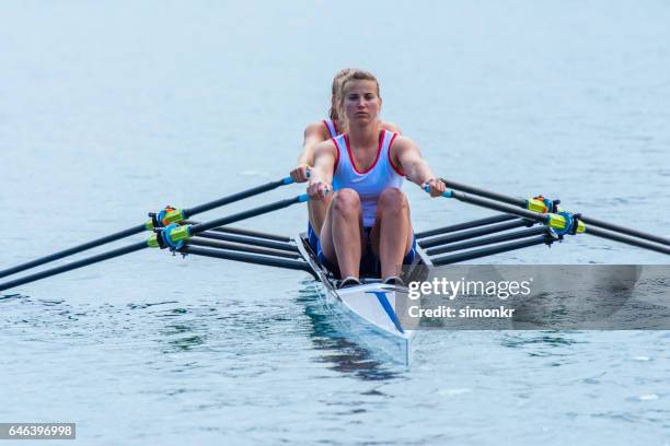 women rowing boat - coordinated effort stock pictures, royalty-free photos & images